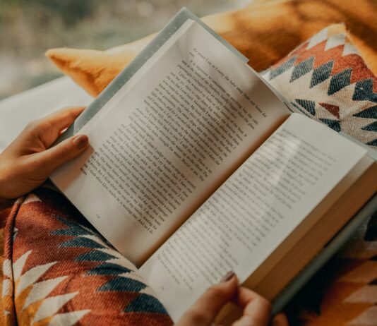 “쉼 없이 살아가는 우리, 만성피로 탈출할 수 있을까?” person reading book on brown and beige textile